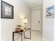 Bright foyer with tile flooring and a stylish console table featuring decorative accents at 224 Soliera St, Nokomis, FL 34275
