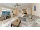 Inviting living room features tiled floors, a comfortable sectional sofa, and ample natural light at 224 Soliera St, Nokomis, FL 34275