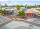 Aerial view of a vibrant intersection with restaurants, cafes, and colorful street art at 2551 Waneta Dr, Sarasota, FL 34231