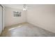 Empty bedroom features bright lighting, tile floor and closet at 2551 Waneta Dr, Sarasota, FL 34231