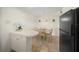 Dining area with tile floor and a wooden table with seating for six at 2551 Waneta Dr, Sarasota, FL 34231