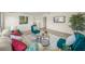 Comfortable living room with stylish decor, tile floors, and a partial view of the dining room at 2551 Waneta Dr, Sarasota, FL 34231