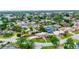 Aerial view of neighborhood with mature landscaping and colorful rooftops at 3072 Meyer Dr, Sarasota, FL 34239