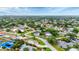 Aerial view of a quiet neighborhood with mature trees and well-maintained lawns at 3072 Meyer Dr, Sarasota, FL 34239