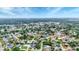 Expansive aerial view of a leafy residential community under a clear blue sky at 3072 Meyer Dr, Sarasota, FL 34239