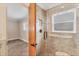 Bathroom features a tiled shower and window, as well as an entry view to the bedroom at 3072 Meyer Dr, Sarasota, FL 34239