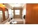 Bathroom featuring tiled walls, a vanity, and tub with shower at 3072 Meyer Dr, Sarasota, FL 34239