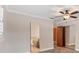 Well-lit bedroom with tile floors, crown molding, closet and bathroom access at 3072 Meyer Dr, Sarasota, FL 34239