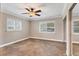 Bedroom with tile flooring, ceiling fan, and shuttered windows at 3072 Meyer Dr, Sarasota, FL 34239