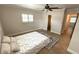 Cozy bedroom with neutral paint, tiled flooring, and a ceiling fan at 3072 Meyer Dr, Sarasota, FL 34239