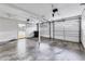 Spacious two-car garage with overhead lighting and door to the exterior at 3072 Meyer Dr, Sarasota, FL 34239