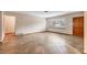 Spacious living room with tile floors, a large window offering ample natural light, and neutral wall colors at 3072 Meyer Dr, Sarasota, FL 34239