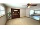 Spacious carpeted living room with custom built-ins and shutters at 3072 Meyer Dr, Sarasota, FL 34239
