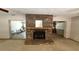 Carpeted living room showcasing a brick fireplace and mantle at 3072 Meyer Dr, Sarasota, FL 34239