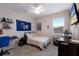 Bedroom featuring a bed, window, TV, and desk at 3210 Desert Plain Cv, Lakewood Ranch, FL 34211