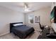Bedroom featuring a bed, window, TV, and desk at 3210 Desert Plain Cv, Lakewood Ranch, FL 34211