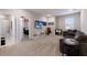 Spacious game room with a TV, arcade game, and comfortable seating at 3210 Desert Plain Cv, Lakewood Ranch, FL 34211