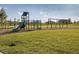 Well-maintained community playground featuring modern play equipment and ample green space for children to enjoy at 3210 Desert Plain Cv, Lakewood Ranch, FL 34211