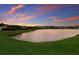 A beautiful pond featuring a sunset sky at 3210 Desert Plain Cv, Lakewood Ranch, FL 34211