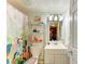 Bright bathroom featuring vanity with sink and flamingo-themed shower curtain at 3562 Lake Bayshore Dr # 202, Bradenton, FL 34205