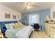 Inviting bedroom featuring a cozy bed, writing desk, and seaside-inspired decor, perfect for relaxation at 3562 Lake Bayshore Dr # 202, Bradenton, FL 34205