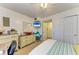 Comfortable bedroom featuring a spacious closet, side table, and calming nautical décor, ideal for relaxation at 3562 Lake Bayshore Dr # 202, Bradenton, FL 34205