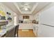 Well-lit kitchen featuring white appliances, ample cabinet space, and a cozy breakfast nook for casual dining at 3562 Lake Bayshore Dr # 202, Bradenton, FL 34205