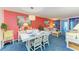 Open living room, nicely decorated with coral accent wall at 3562 Lake Bayshore Dr # 202, Bradenton, FL 34205