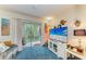Inviting living area with large TV and sliding glass doors to the lanai at 3562 Lake Bayshore Dr # 202, Bradenton, FL 34205