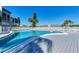 Community swimming pool featuring a spacious deck with lounge chairs, perfect for relaxation at 3562 Lake Bayshore Dr # 202, Bradenton, FL 34205