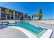 Resort style swimming pool with lounge chairs and sunny skies at 3562 Lake Bayshore Dr # 202, Bradenton, FL 34205