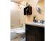 Well-lit bathroom featuring a shower-tub combination, toilet, and vanity at 3915 40Th W St, Bradenton, FL 34205