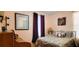 Inviting bedroom features soft lighting, dresser, and a comfortable patterned duvet at 3915 40Th W St, Bradenton, FL 34205