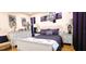 Comfortable bedroom featuring a well-decorated bed and furnishings with a purple color theme at 3915 40Th W St, Bradenton, FL 34205