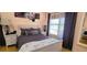 Comfortable bedroom with a large window providing ample natural light and calming lake view at 3915 40Th W St, Bradenton, FL 34205