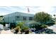 The Lakeside South building with well-maintained landscaping and a clear view of the American flag at 3915 40Th W St, Bradenton, FL 34205
