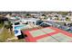 Aerial view of community amenities including pool, tennis courts, playground, and parking at 3915 40Th W St, Bradenton, FL 34205