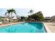 Beautiful community pool area featuring comfortable seating and lush landscaping at 3915 40Th W St, Bradenton, FL 34205