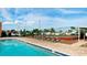 Inviting community pool with lounge chairs alongside a tennis court for relaxation and recreation at 3915 40Th W St, Bradenton, FL 34205