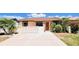 Charming home with a well-maintained front yard, complemented by lush greenery and plants at 3915 40Th W St, Bradenton, FL 34205
