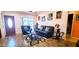 Inviting living room featuring hardwood floors, stylish furnishings, and a modern entertainment setup at 3915 40Th W St, Bradenton, FL 34205