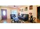 Inviting living room featuring hardwood floors, stylish furnishings, and a modern entertainment setup at 3915 40Th W St, Bradenton, FL 34205