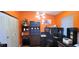 Bright home office with stylish lighting, and built-in shelving for storage and organization at 3915 40Th W St, Bradenton, FL 34205