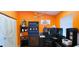 Bright home office with stylish lighting, and built-in shelving for storage and organization at 3915 40Th W St, Bradenton, FL 34205