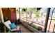 Cozy screened porch with comfortable seating overlooking a tranquil pond at 3915 40Th W St, Bradenton, FL 34205