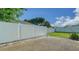 Backyard features white vinyl fence enclosing a gravel area and grassy lawn, offering privacy at 4015 52Nd Street W Ct, Bradenton, FL 34209