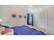 Bedroom featuring a plush bed, serene decor, and natural light, creating a relaxing ambiance at 4015 52Nd Street W Ct, Bradenton, FL 34209