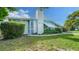 Charming single-story home with well-maintained lawn, mature trees and a welcoming front door at 4015 52Nd Street W Ct, Bradenton, FL 34209