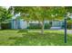 Charming single-story home with well-maintained lawn, mature trees and welcoming curb appeal at 4015 52Nd Street W Ct, Bradenton, FL 34209
