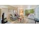 Open living room featuring hardwood floors, neutral walls and comfortable seating for relaxation at 4015 52Nd Street W Ct, Bradenton, FL 34209